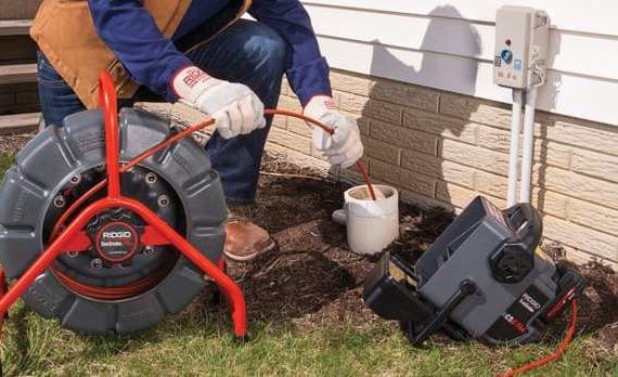 45th Parallel Home Inspections performing a sewer scope as part of a sewer line inspection and home inspection.