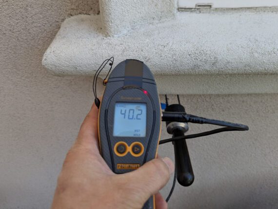 EIFS moisture probe service into the exterior cladding of a home during an EIFS Inspection.